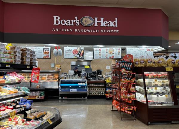 Interior view of a Safeway store hosting a Boar's Head deli with shelves full of groceries in San Anselmo, California