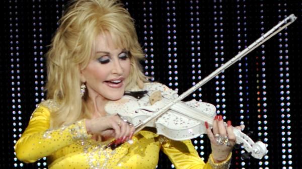 Dolly Parton playing the fiddle