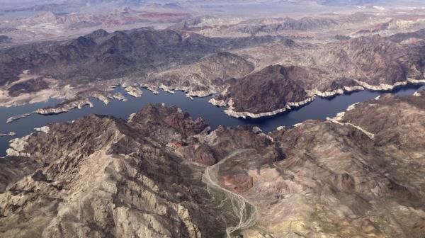 FILE - A bathtub ring shows where the water mark on Lake Mead once was along the border of Nevada and Arizona, March 6, 2023, near Boulder City, Nev. Nearly half of the U.S. West has emerged from drought, but intense water challenges persist, scientists said Tuesday, May 9. (AP Photo/John Locher, File)