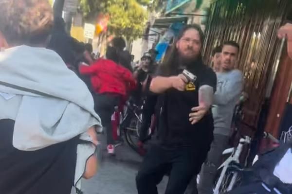 A liquor store worker pulled a gun out on a mob of bikers who attacked him on Saturday in Oakland, CA.